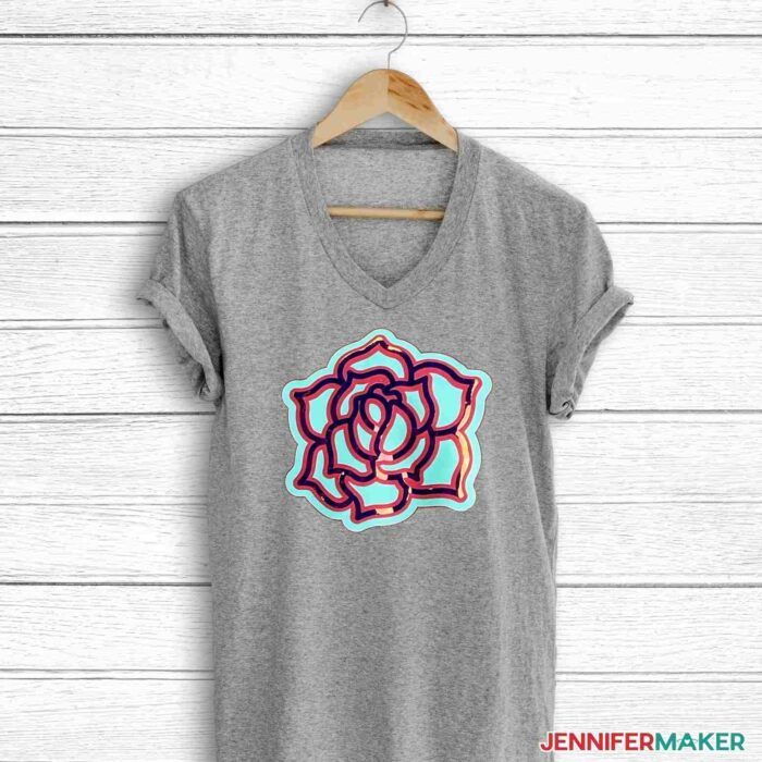 Gray shirt with layered heat transfer vinyl rose in blue and holographic iron-on vinyl