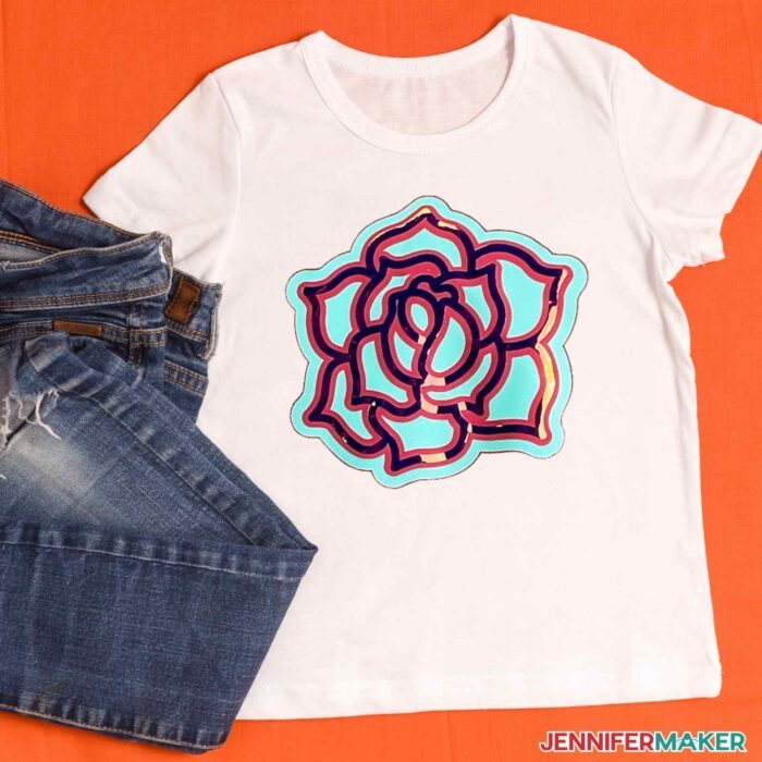 White shirt with layered heat transfer vinyl rose in blue and holographic iron-on vinyl