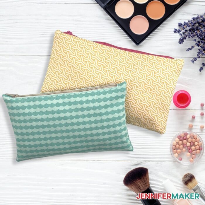 Two DIY Zipper Pouch laying flat in the colors teal and yellow