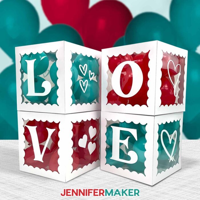 Learn how to make DIY Balloon Boxes with Letters with Jennifer Maker's tutorial! A set of four letter boxes spells out "LOVE" and is filled with vibrant red and teal balloons.