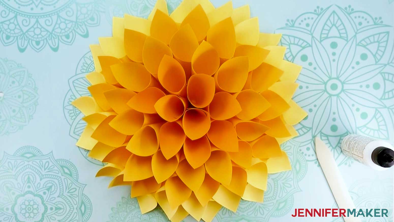 Image of assembled cone shape Giant Paper Dahlia with assembly tools