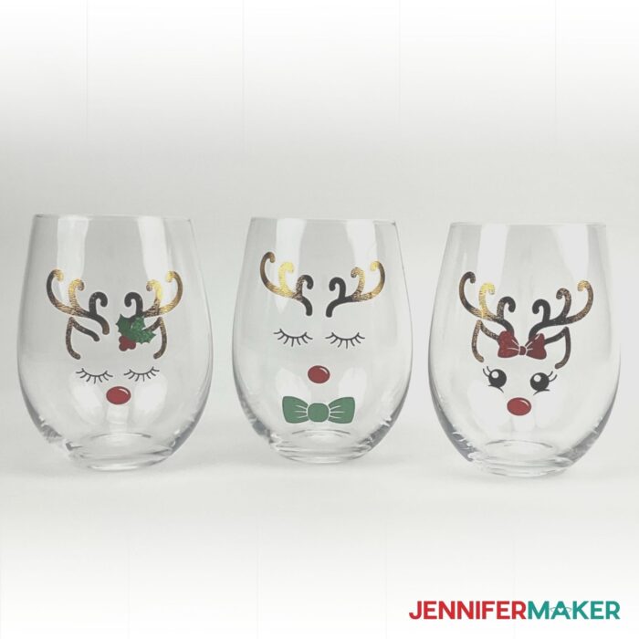 Three DIY Personalized Wine Glasses with Reindeer decals applied to them