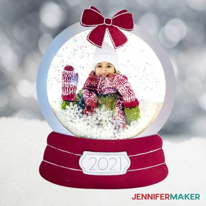 Photo Snowglobe Ornament with a photo of a girl saying waving hello