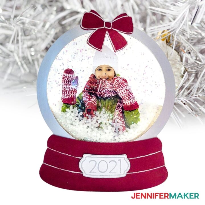 Snowglobe Photo Ornament with a photo of a girl waving hello