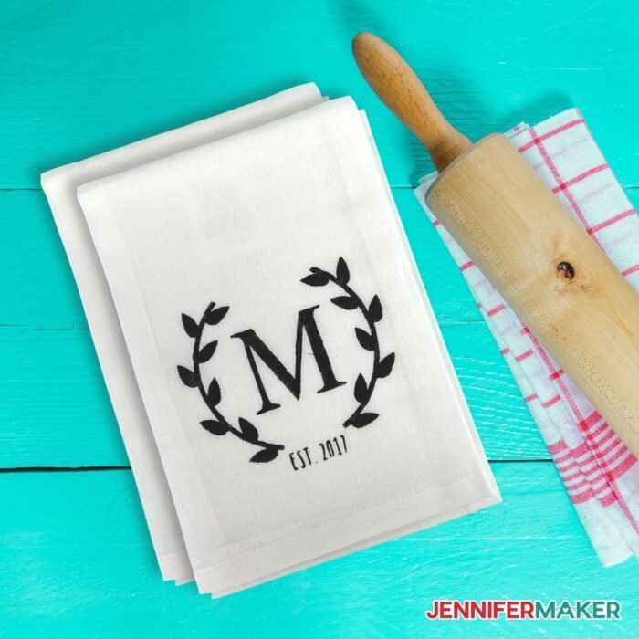 The letter M on a towel made with a reusable stencil and Cricut cutting machine