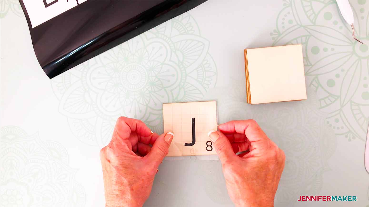 line transfer tape up with the tile for a centered placement of letter for my scrabble wall art