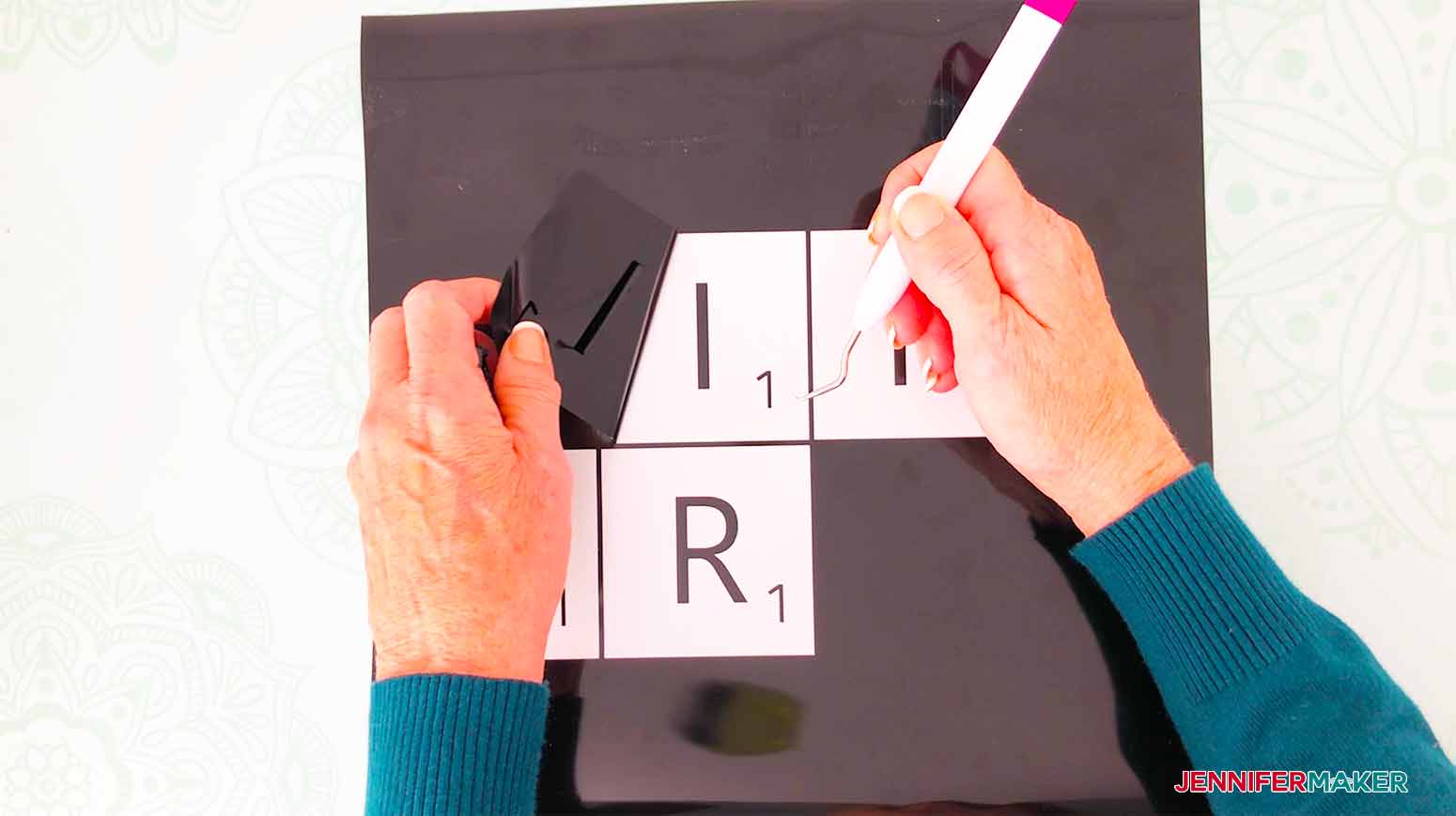 use a weeding tool to weed out the vinyl not needed for my scrabble wall art