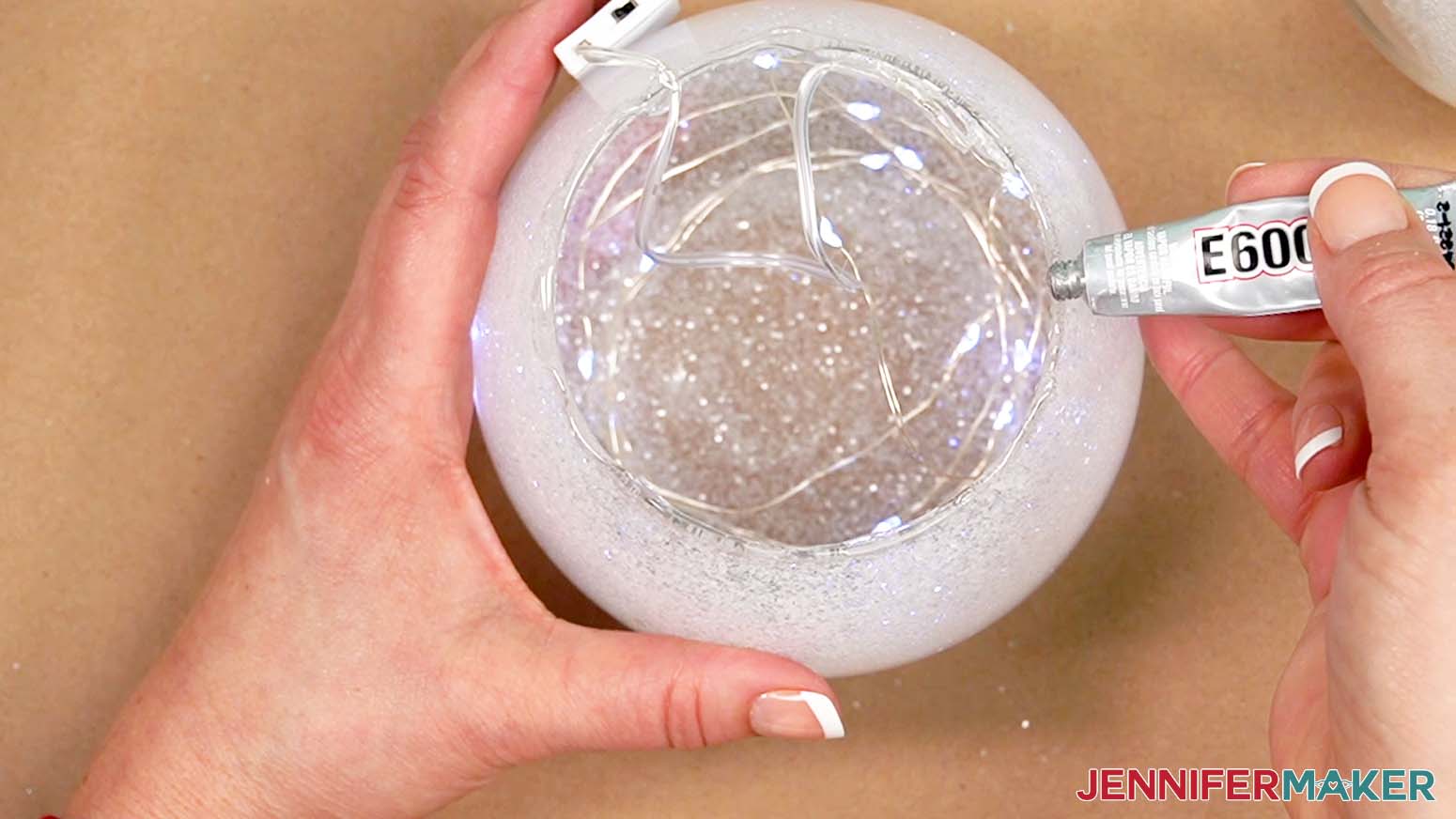 Add e6000 glue around the rim of the vase.