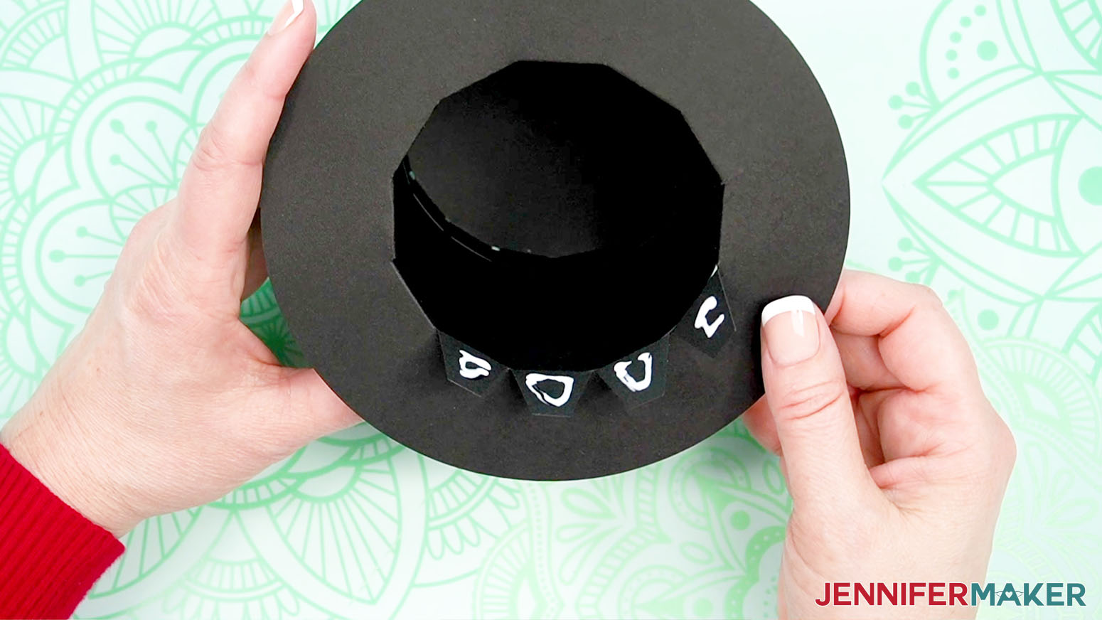 Add craft glue to the tabs of the brim.
