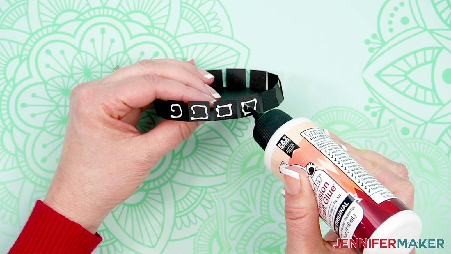 Apply craft glue around the folded tabs of the top of the hat.