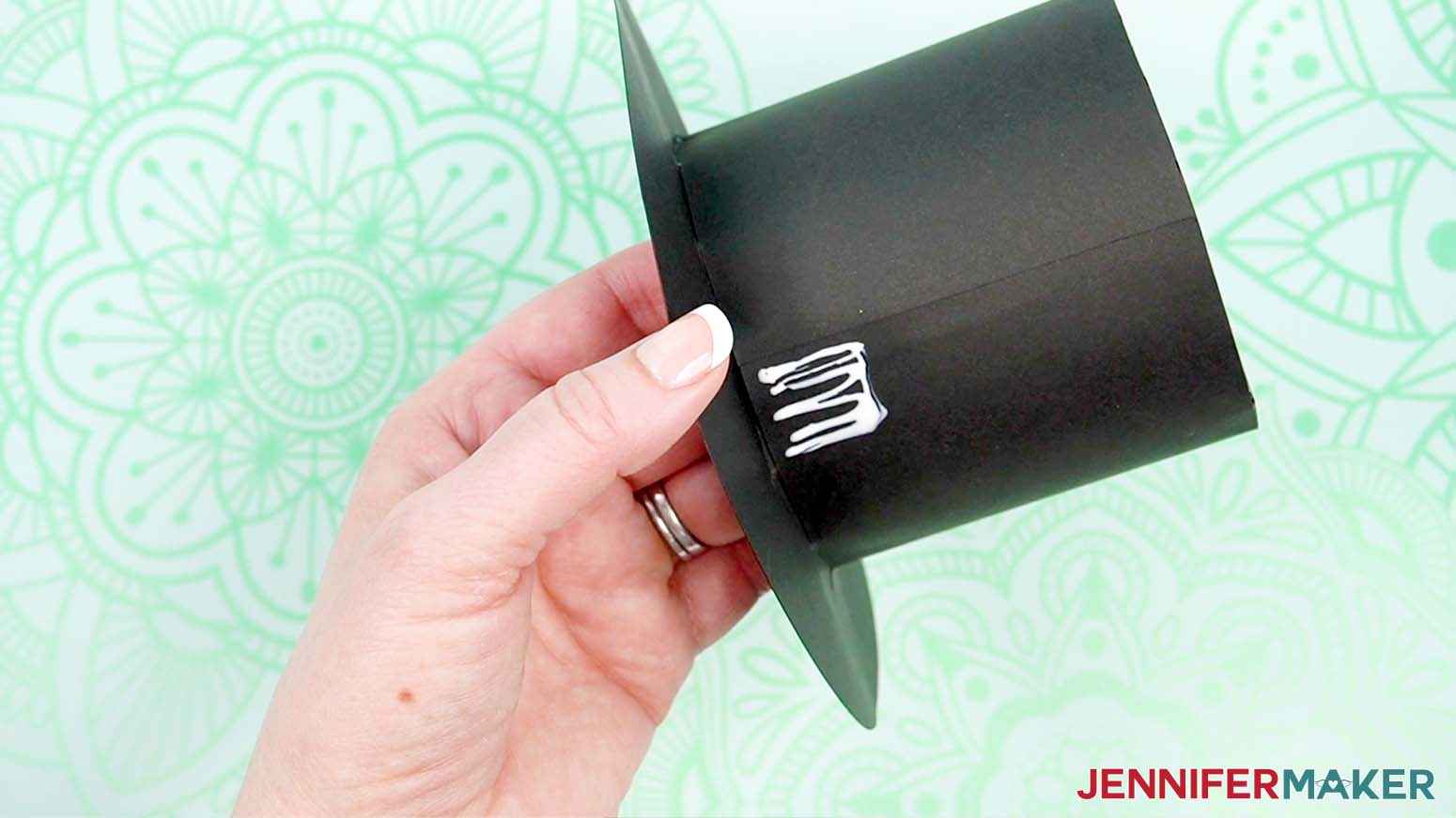 Add craft glue to the side, in the back, long the brim.