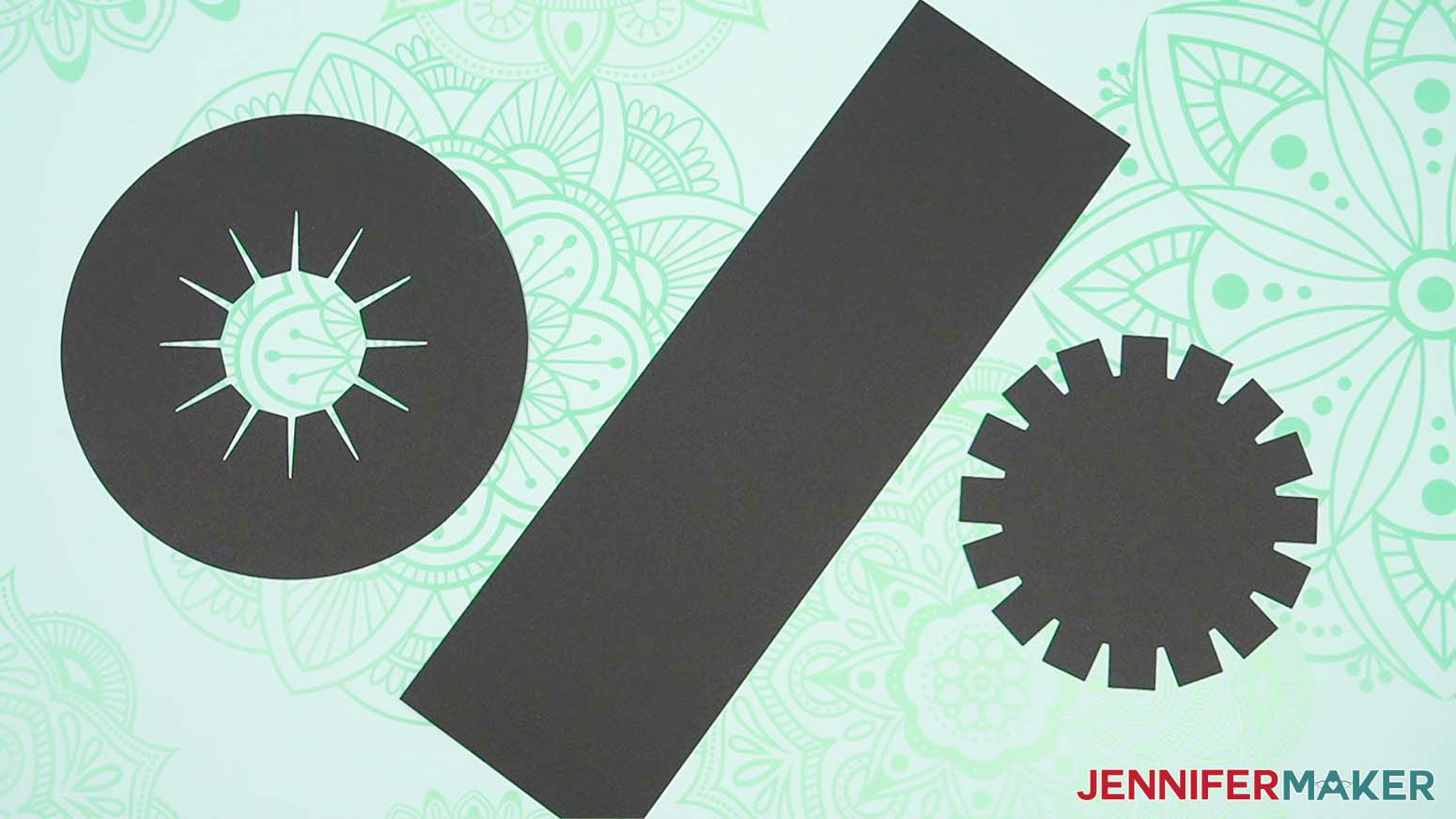 Cut pieces of black cardstock ready to be assembled in the snowman hat.