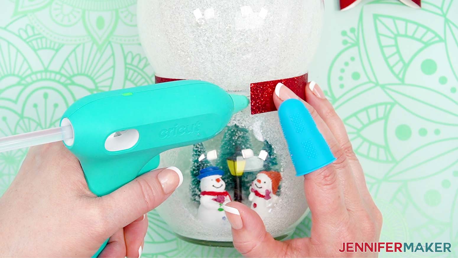 Add hot glue under the ends of the neck back to secure it on the glass vase.