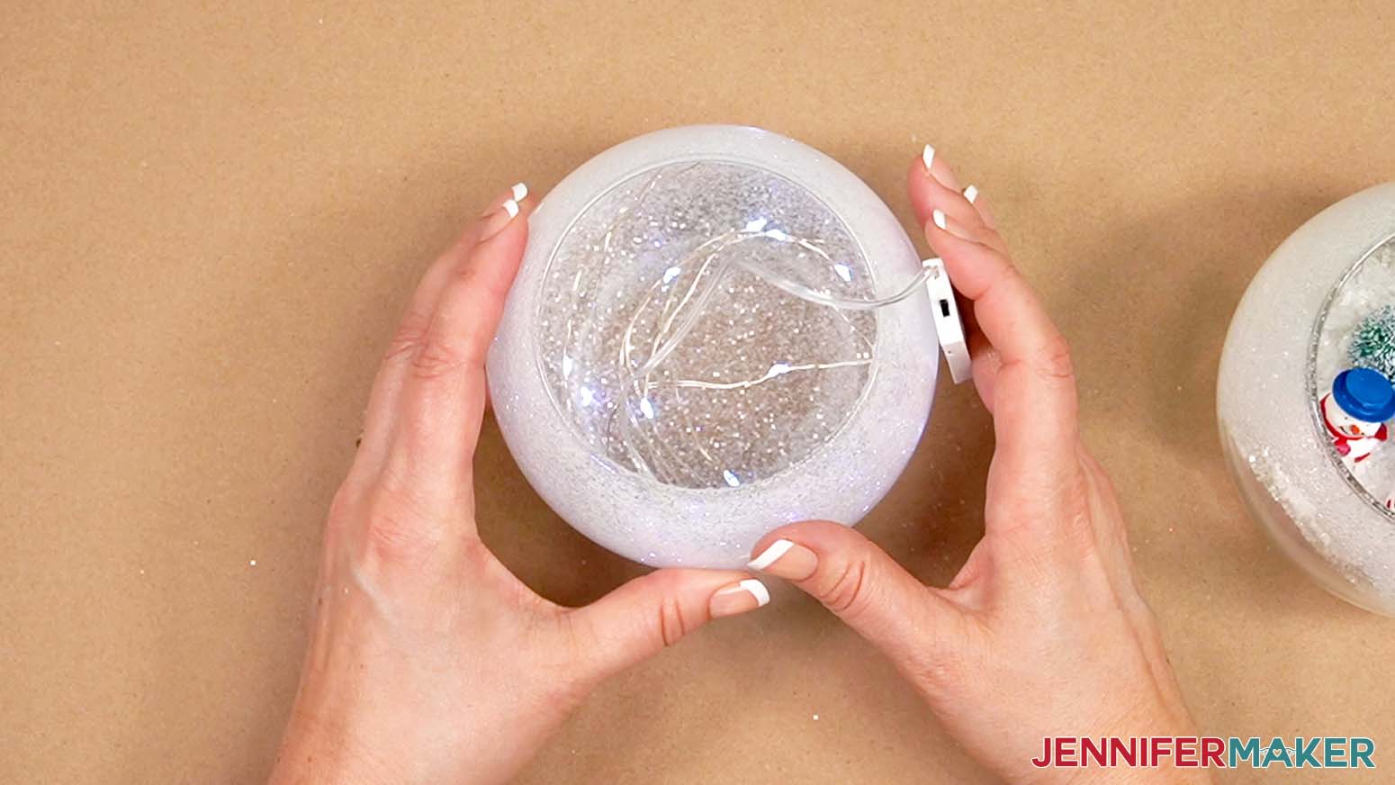 Place the fairy lights into the upper vase that will have the face.