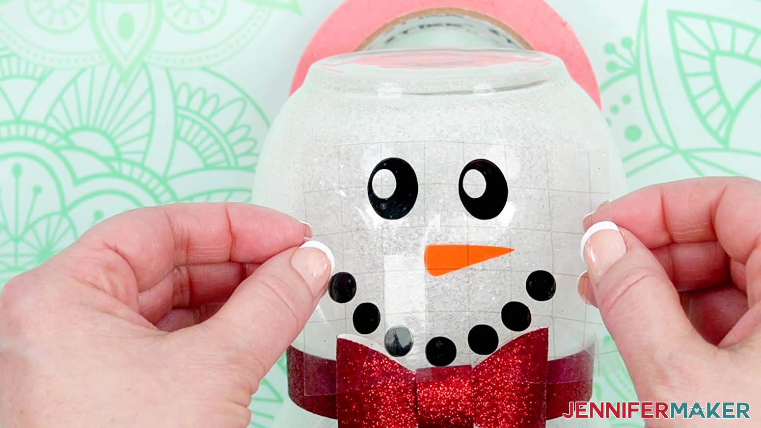 Place the vinyl face on the glass snowman.