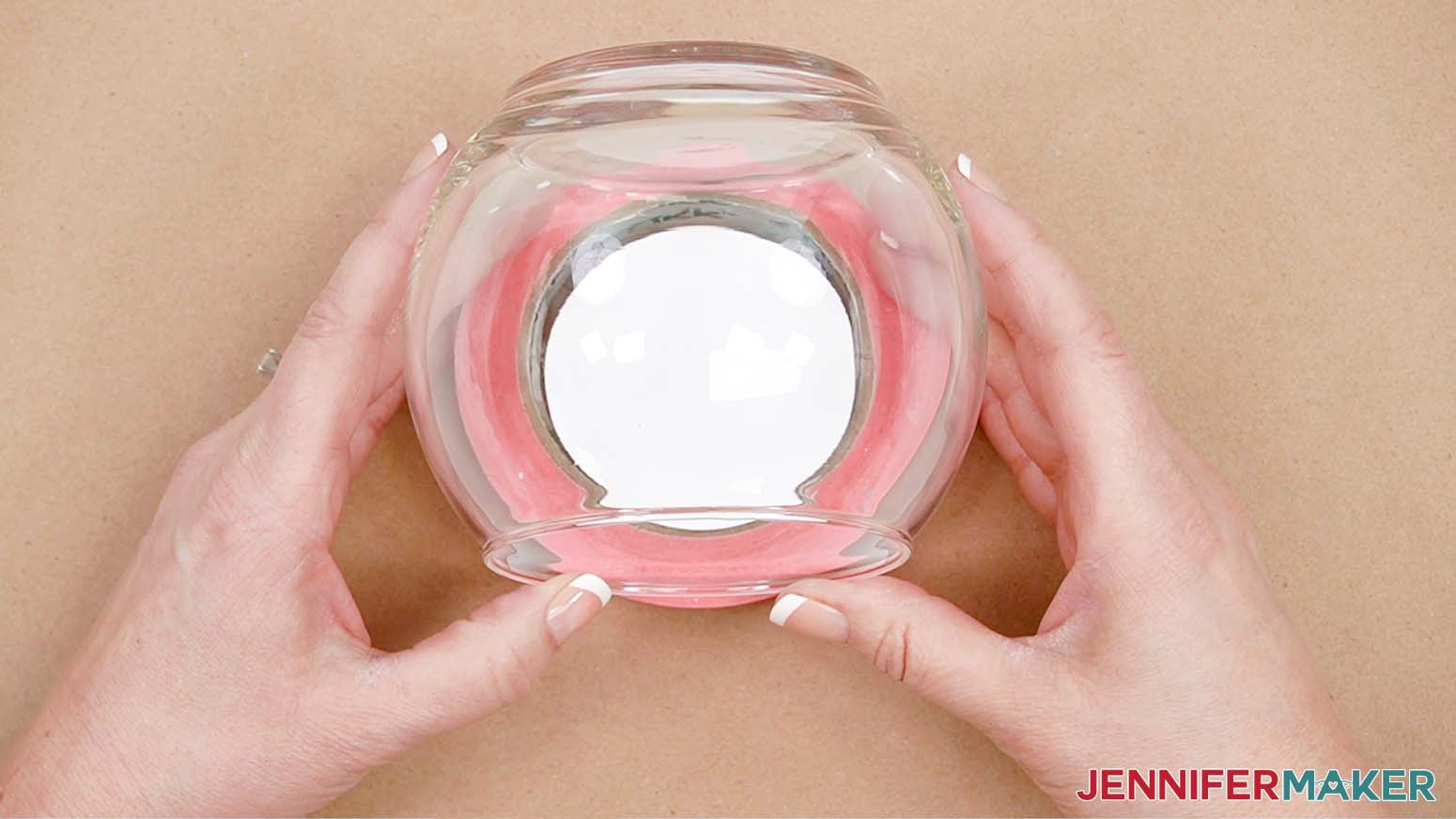 Position and place the vinyl circle on the inside of the vase where the viewing circle will be.
