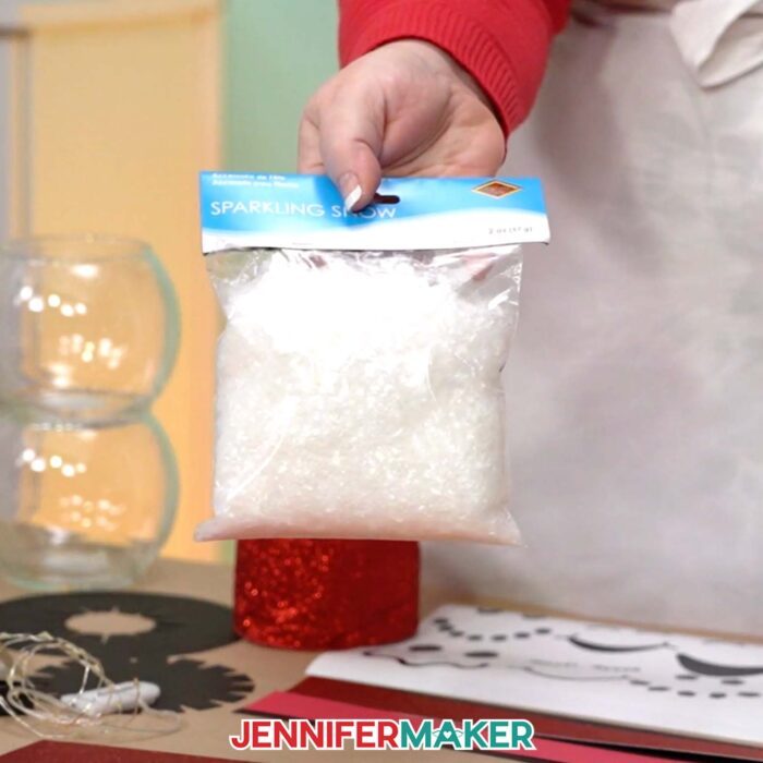 Jennifer shows the faux snow used to make a Snowman With Belly Scene