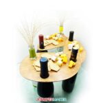 Wood wine bottle serving tray with wine bottles and cheese
