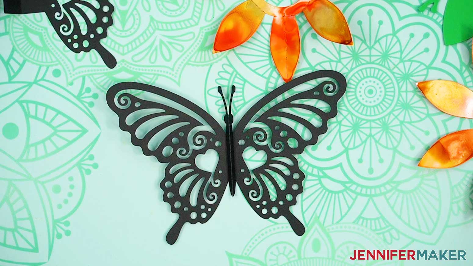 Crease the top butterfly piece along the body for the alcohol ink pop up card.