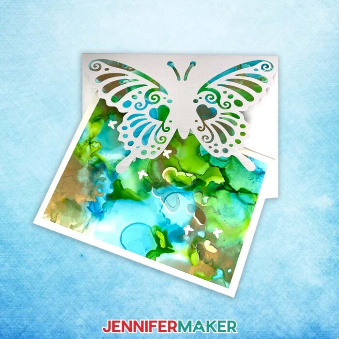 Alcohol Ink On Paper butterfly pop-up card with blues and greens and a matching envelope