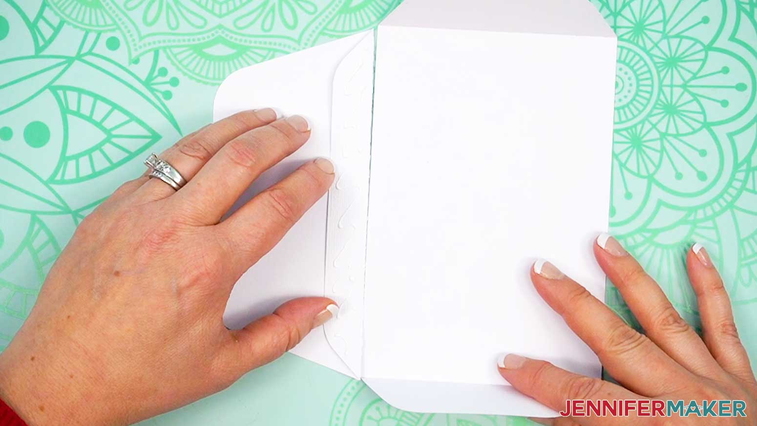 Glue the bottom of the Joy-sized envelope to the base using the tab.