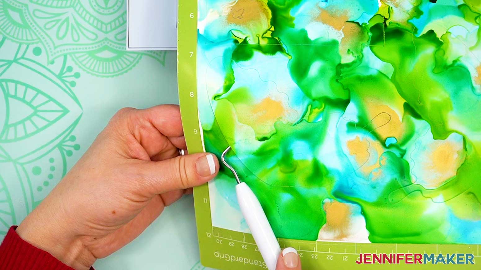 Before unloading the Cricut mat, lift a corner of the cut paper with a weeding tool to check if the cut went all the way through.