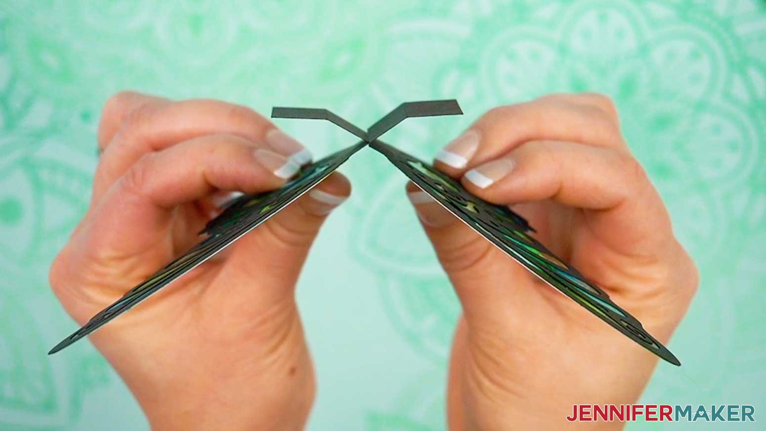 Slot the two butterfly wing pieces together before attaching them to the pop up card.