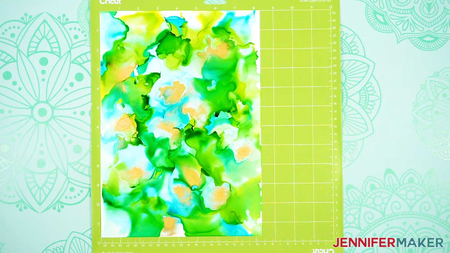 Place your paper prepared with alcohol inks face up on a green machine mat.