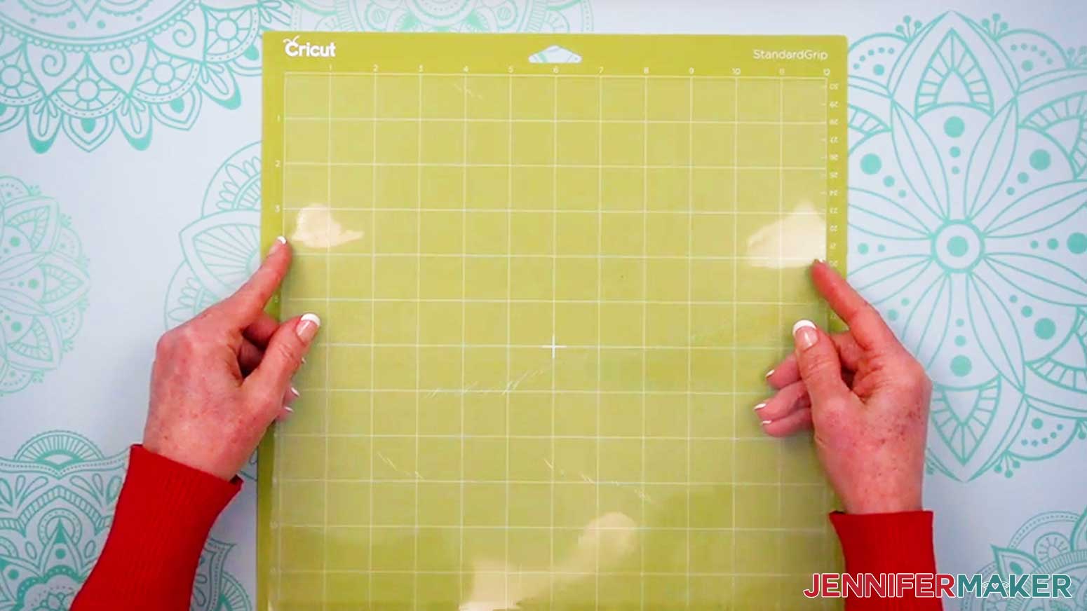 Place the acetate sheet for the Alcohol Ink Stained Glass design exposed side up on the green machine mat.