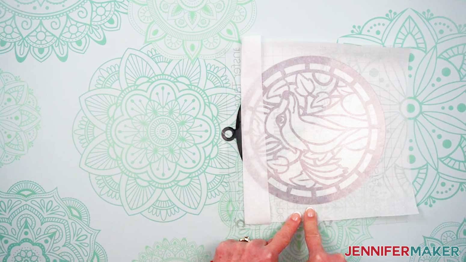 Place the acetate layer onto the parchment and exposed vinyl area of the Alcohol Ink Stained Glass design.