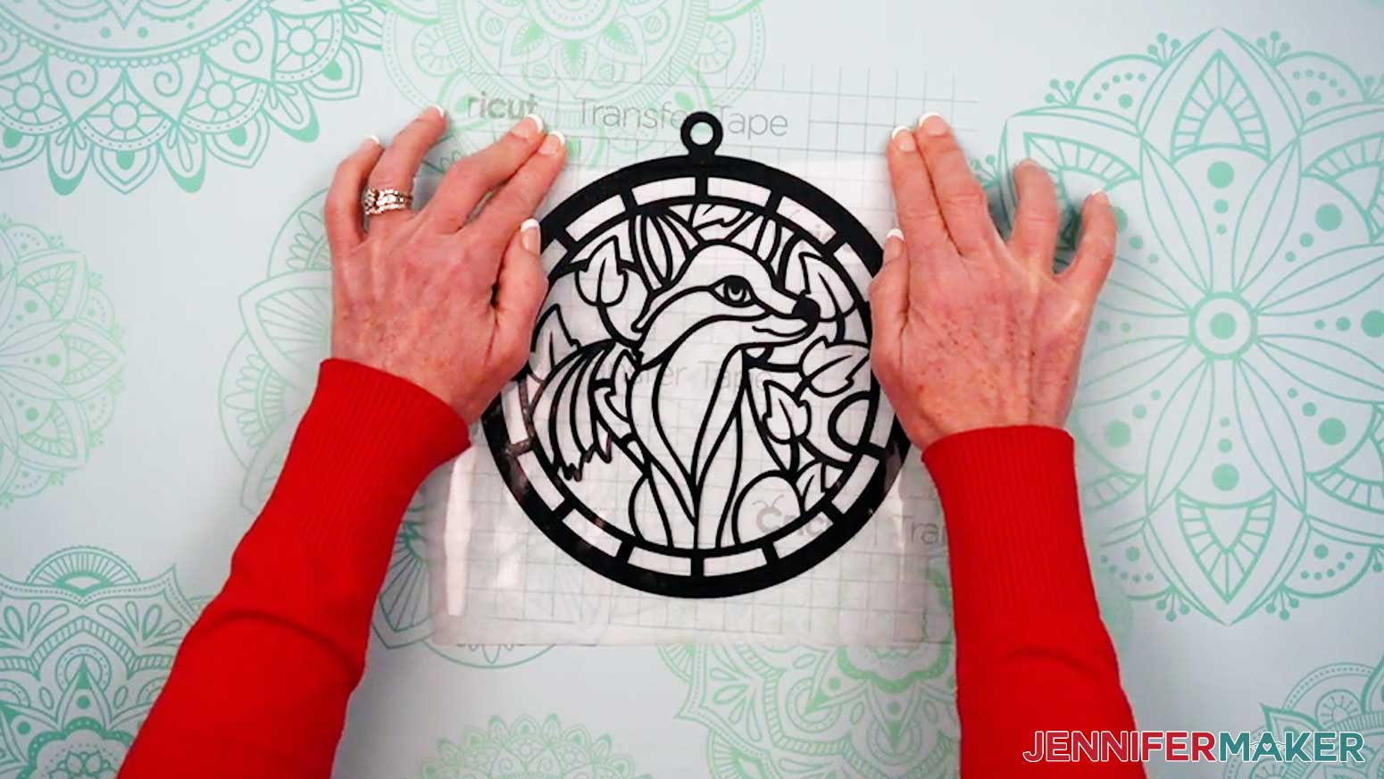 Align the second vinyl piece with the previous pieces of the Alcohol Ink Stained Glass design.