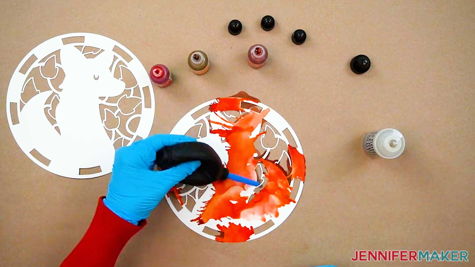 Use a blower to move the ink around on the paper for the Alcohol Ink Stained Glass design.