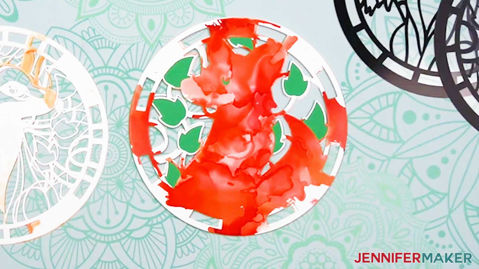 Adhere mirror layers on each side of the design to build up the Alcohol Ink Stained Glass design from the middle out.