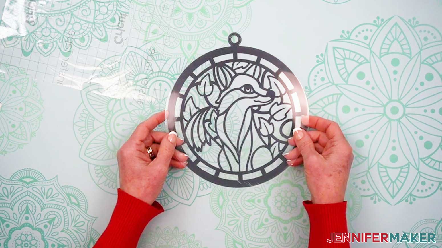 Align the second layer of acetate to the first layer that has the first layer of vinyl for the Alcohol Ink Stained Glass design already applied.