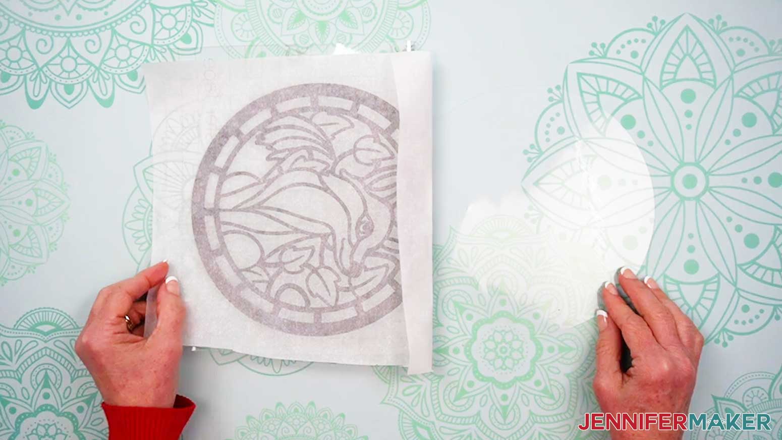 Open the vinyl and acetate layers of the Alcohol Ink Stained Glass design like a book with the parchment still covering the remaining unattached vinyl.