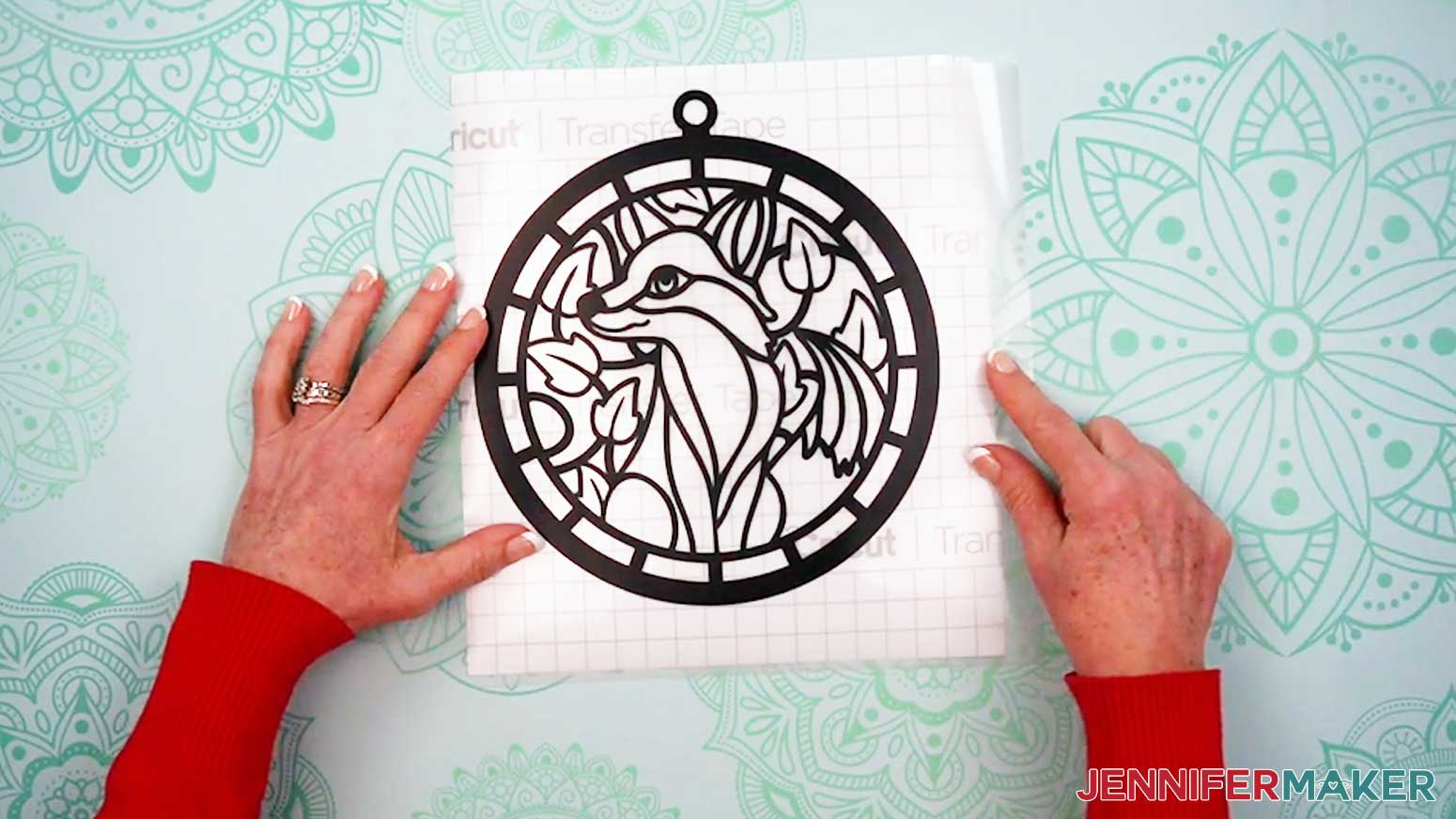 Cut a piece of transfer tape slightly larger than the vinyl layer of the Alcohol Ink Stained Glass design.