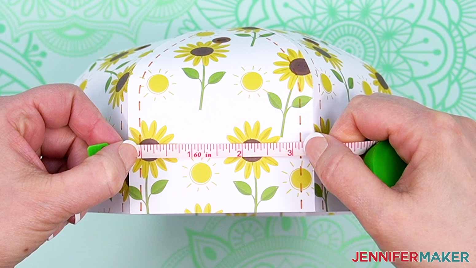 Use a soft measuring tape to measure the width of the dome panel between the stitch marks.