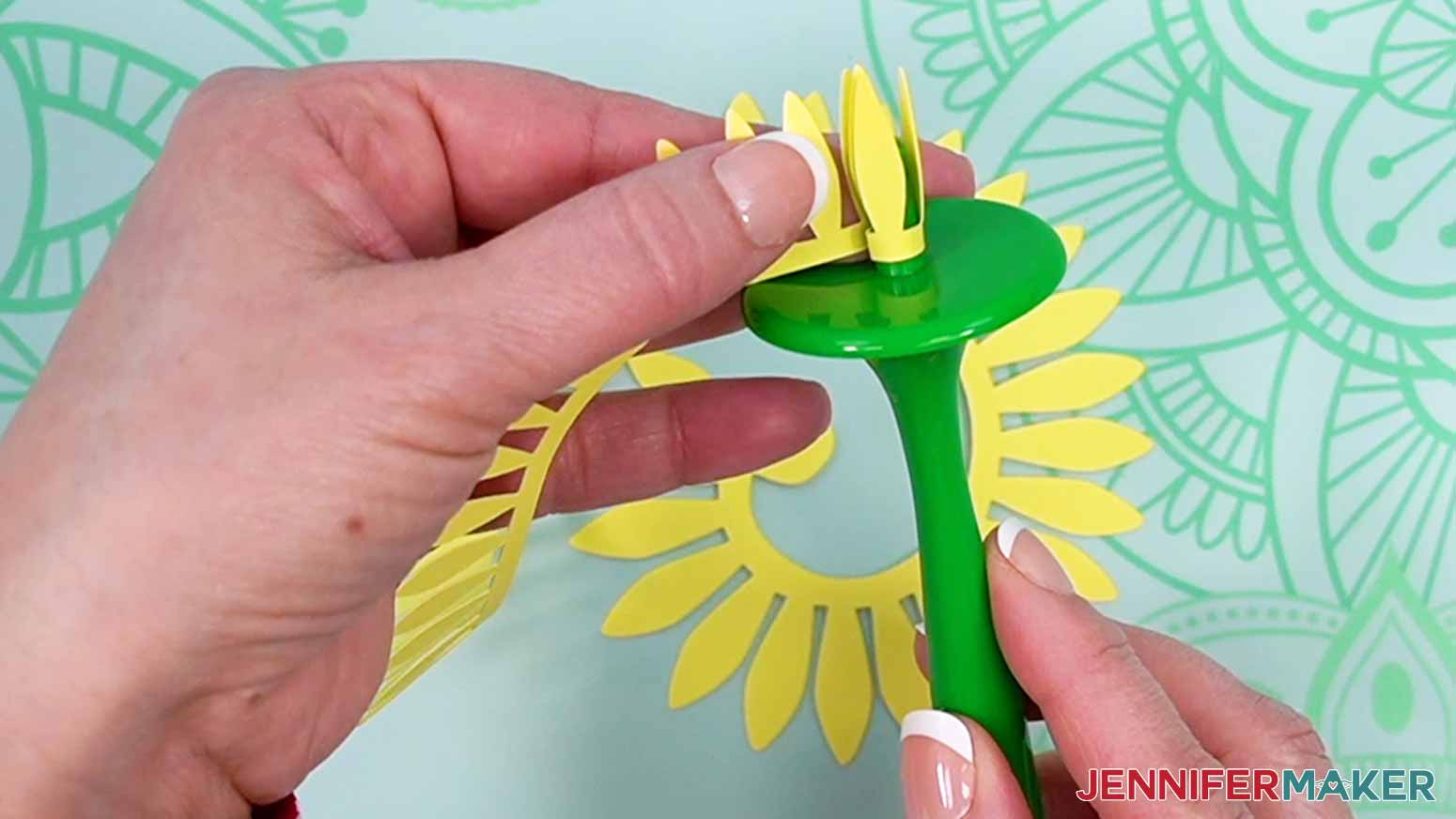 Wrap the petals around the center of the tool to create the sunflower.