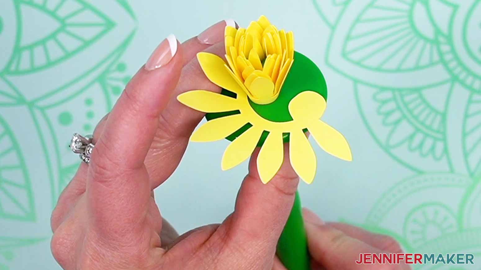 Leave the last part of the flower away from the center to add glue to secure it closed.