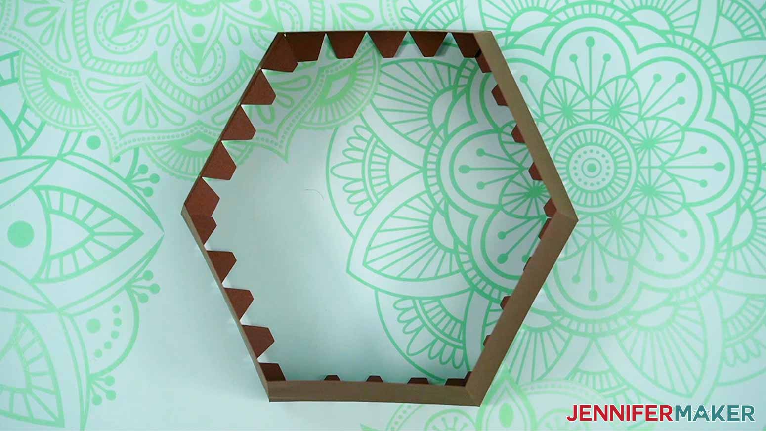 The box sides will look like a hexagon shape when all of the edges are glued together.