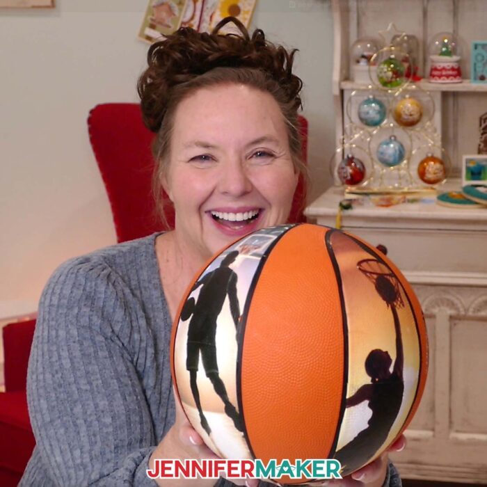 Jennifer shows off a custom photo basketball with two photo panels covered in printable heat transfer material.