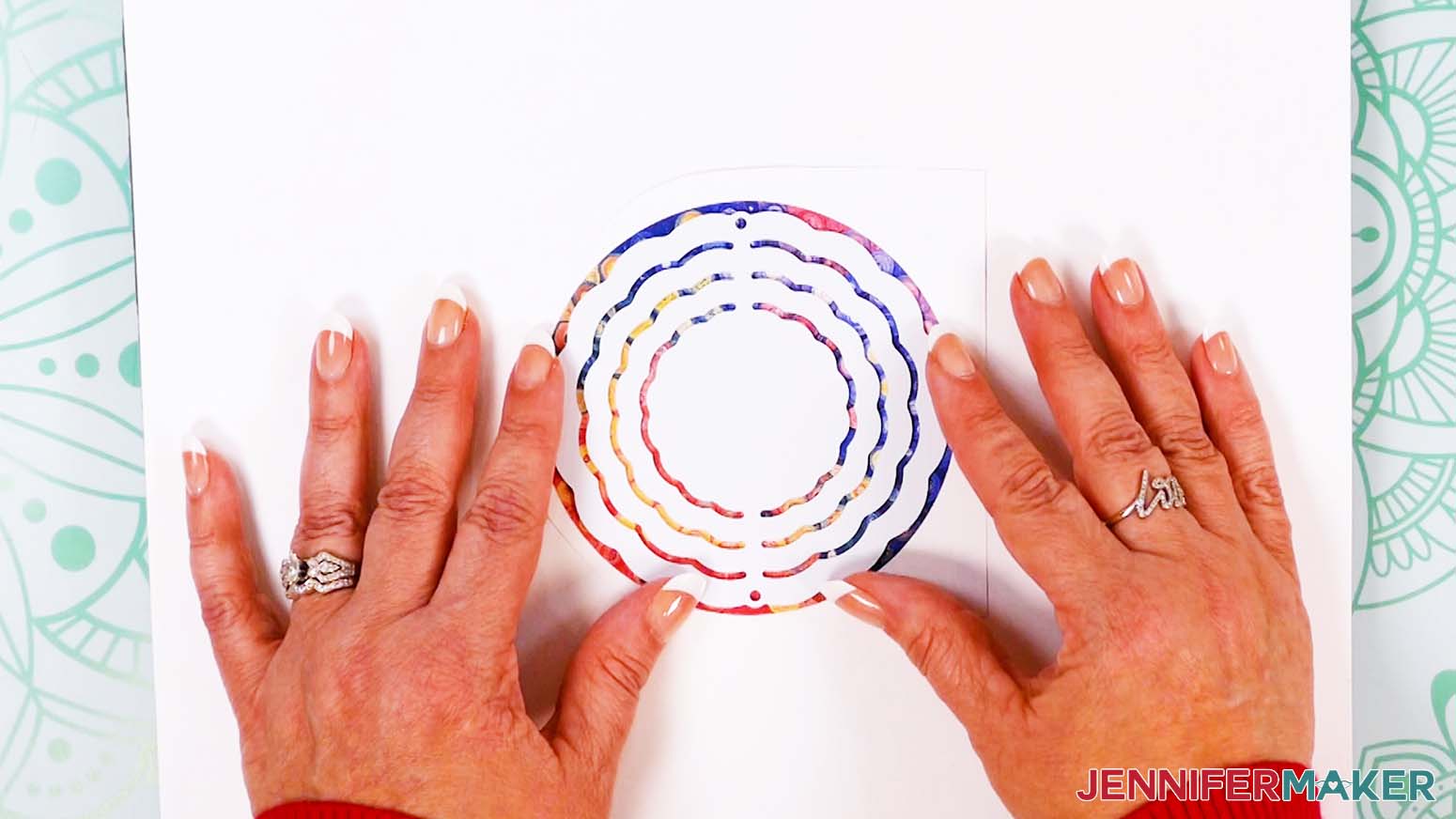 place wind spinner on top of design leaving a smaller margin around all edges.