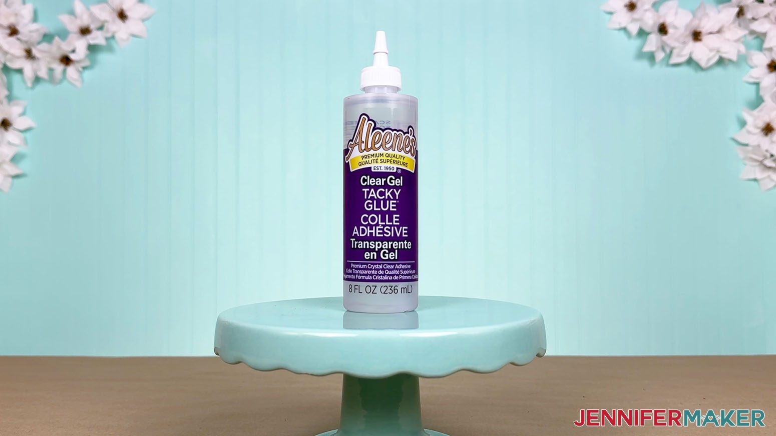 The Aleene's Clear Gel Tacky Glue bottle is arranged on a display table for the Best Craft Glues test.