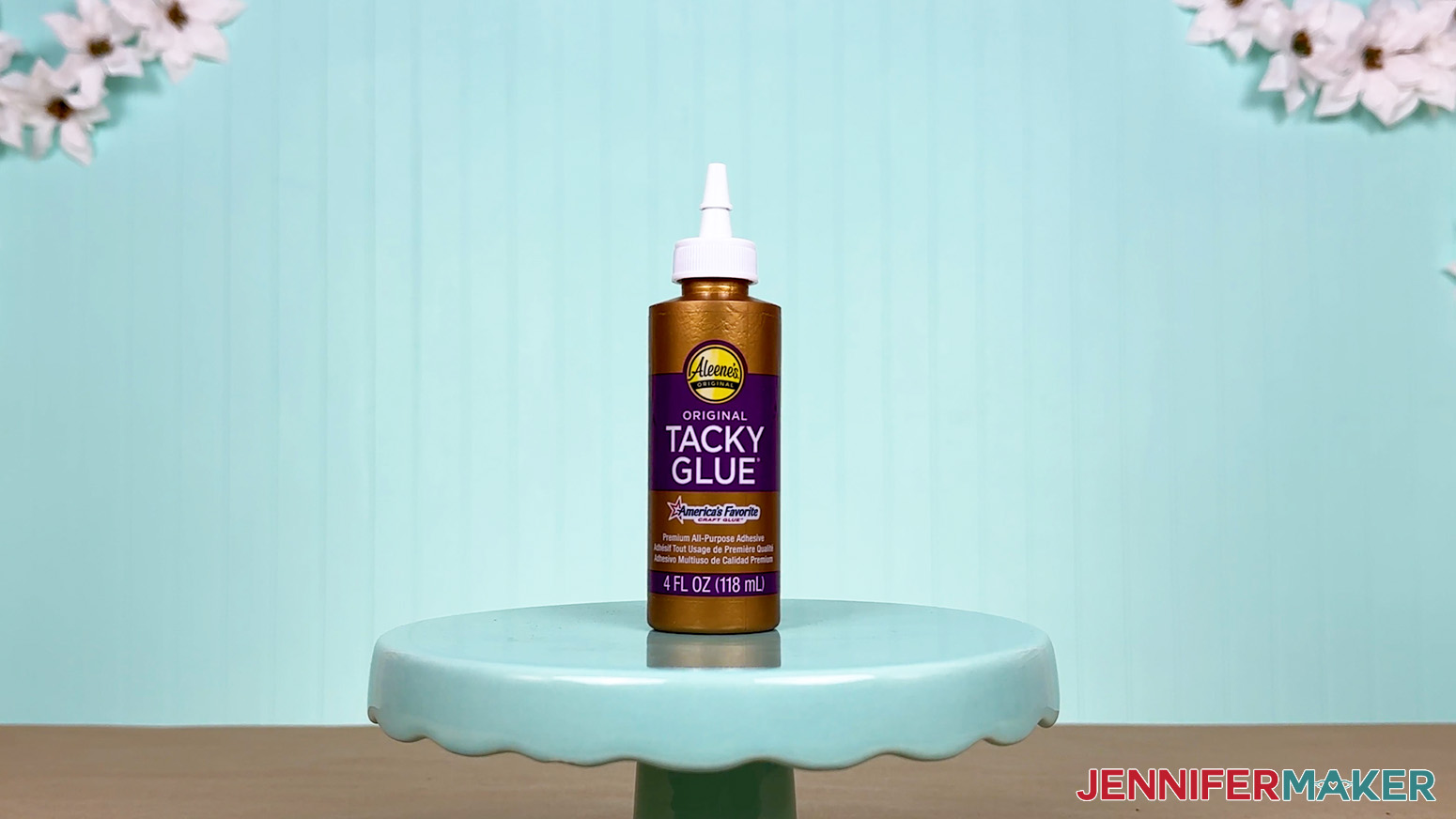 The Aleene's Tacky Glue bottle is arranged on a display table for the Best Craft Glues test.