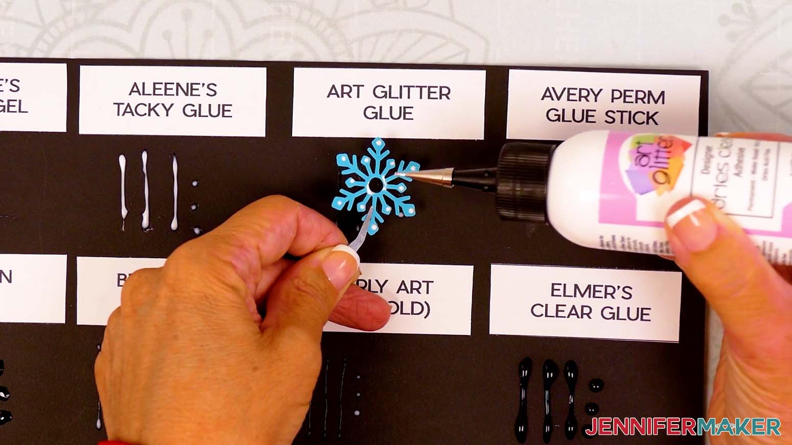 The Best Craft Glues Art Glitter glue sample is tested for precision on the finely cut paper snowflake.