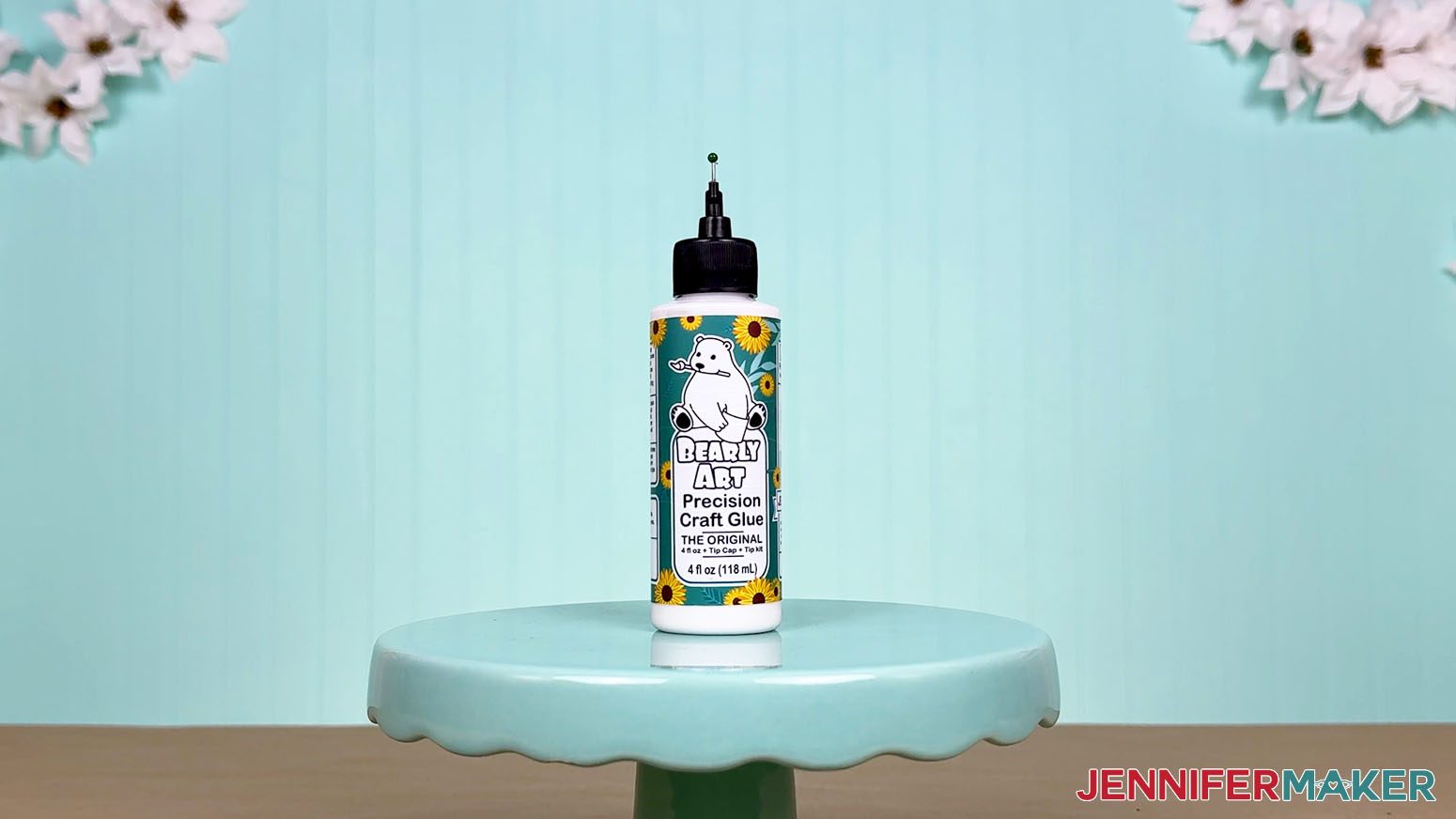 The old Bearly Art glue bottle is arranged on a display table for the Best Craft Glues test.