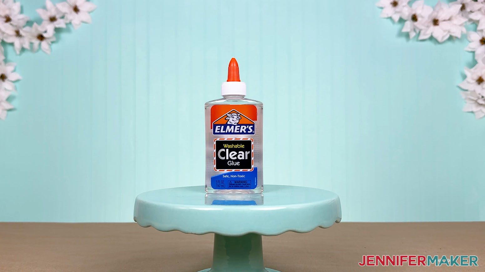 The Elmer's Clear Glue bottle is arranged on a display table for the Best Craft Glues test.