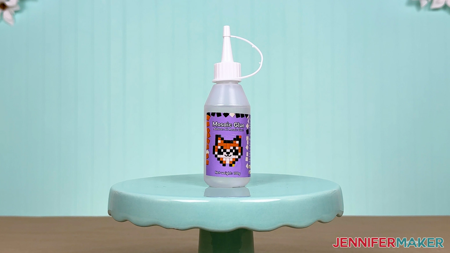 The Mosaic Glue bottle is arranged on a display table for the Best Craft Glues test.