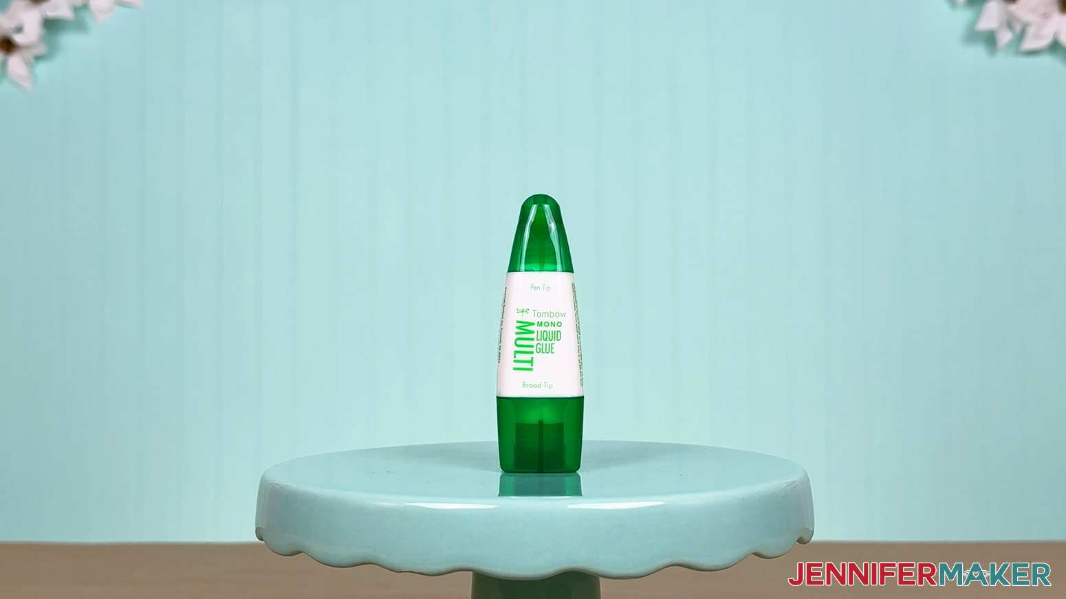 The Tombow glue bottle is arranged on a display table for the Best Craft Glues test.
