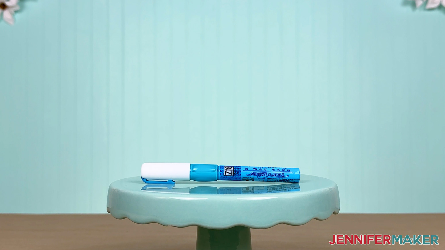 The 1mm Zig 2 Way Glue pen is arranged on a display table for the Best Craft Glues test.